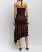 Woman wearing a brown dress with a white background